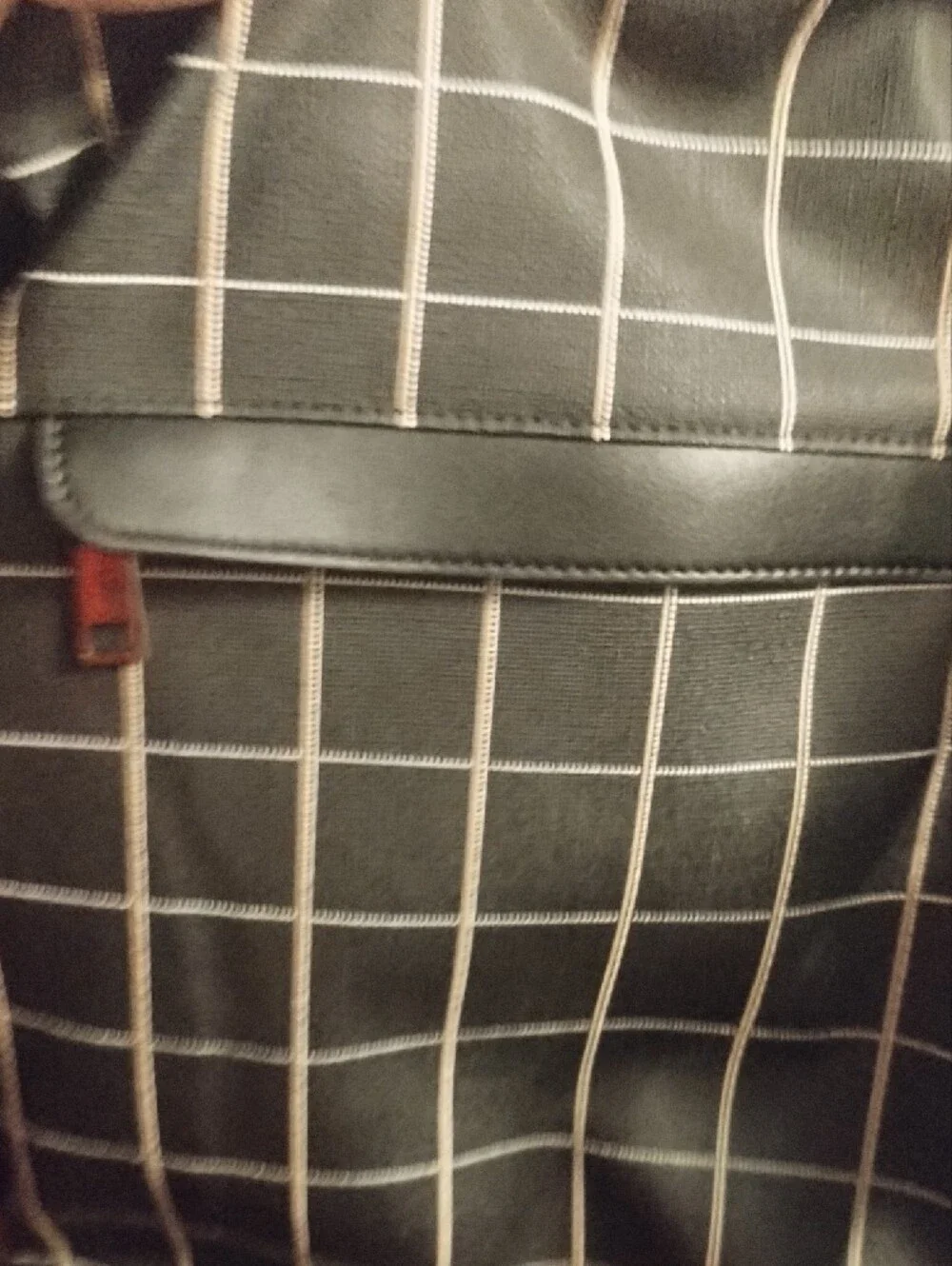 Black Grid-Pattern Backpack with Contrast Brown Strap
